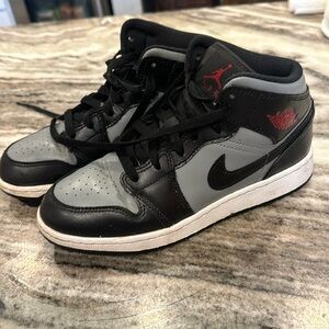 Black and gray air Jordan’s. Youth. Size 4.5